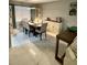 Bright dining room adjacent to living and kitchen with contemporary decor and finishes at 135 S Abalone Dr, Gilbert, AZ 85233