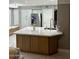 Bright kitchen island with marble countertops and wooden cabinets at 135 S Abalone Dr, Gilbert, AZ 85233