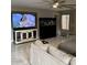 Living room showcasing a large TV and modern aquarium at 135 S Abalone Dr, Gilbert, AZ 85233