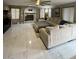 Bright living room featuring a cozy fireplace and sleek tile flooring at 135 S Abalone Dr, Gilbert, AZ 85233
