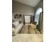 Bright living room features high ceilings, neutral tones, modern art and tile flooring at 135 S Abalone Dr, Gilbert, AZ 85233