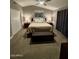 Bedroom with neutral walls and carpet, updated window treatments, a ceiling fan, and ample furniture at 135 S Abalone Dr, Gilbert, AZ 85233