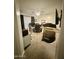 Home office featuring a desk, a chair, and a television at 135 S Abalone Dr, Gilbert, AZ 85233