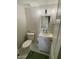 Stylish powder room featuring modern fixtures and decorative wall tiles at 135 S Abalone Dr, Gilbert, AZ 85233