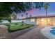 Backyard featuring putting green, gravel areas, and covered patio, perfect for outdoor fun at 1532 W Northern Ave, Phoenix, AZ 85021