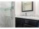 Bathroom featuring vanity, marble countertops, and step-in shower at 1532 W Northern Ave, Phoenix, AZ 85021