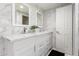 Elegant bathroom featuring double sinks with marble countertops and tiled walls at 1532 W Northern Ave, Phoenix, AZ 85021