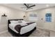 Bedroom featuring dark accents, plenty of natural light, and a comfortable bed for relaxation at 1532 W Northern Ave, Phoenix, AZ 85021