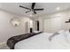 Comfortable bedroom with ceiling fan, closet, and ensuite bathroom access at 1532 W Northern Ave, Phoenix, AZ 85021