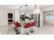Bright, modern kitchen with stainless steel appliances, granite countertops, and a large center island with bar stools at 1532 W Northern Ave, Phoenix, AZ 85021