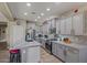 Spacious kitchen featuring granite countertops, stainless steel appliances, and ample cabinet space at 15422 W Ventura St, Surprise, AZ 85379