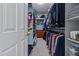 Walk-in closet with ample hanging and shelving space for optimal storage of clothing and personal items at 15422 W Ventura St, Surprise, AZ 85379