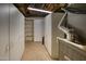 Functional basement storage area with built-in cabinets and tiled flooring for organized living at 1550 N Stapley Dr # 6, Mesa, AZ 85203