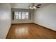 Bedroom featuring a large window that provides natural light and hardwood floors at 1550 N Stapley Dr # 6, Mesa, AZ 85203