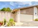 Exterior view of the home with a two car garage, and desert landscaping at 1550 N Stapley Dr # 6, Mesa, AZ 85203