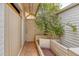 Charming front porch with flowerbed with flowering bush at 1550 N Stapley Dr # 6, Mesa, AZ 85203