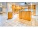 Open concept kitchen with lots of cabinet space, granite countertops, and skylight at 1550 N Stapley Dr # 6, Mesa, AZ 85203