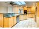 Well-lit kitchen with large island, granite counters, stainless steel appliances, and lots of cabinets at 1550 N Stapley Dr # 6, Mesa, AZ 85203