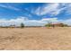 View of a vacant lot and a house at 16415 W Oyer Ln, Surprise, AZ 85387