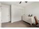 Another bedroom area with a closet, dresser, and a work station in natural light at 16415 W Oyer Ln, Surprise, AZ 85387