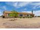 Quaint one-story home with attached two car garage; neutral color scheme blends in with desert landscaping at 16415 W Oyer Ln, Surprise, AZ 85387