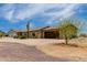 Quaint one-story home with attached two car garage; neutral color scheme blends in with desert landscaping at 16415 W Oyer Ln, Surprise, AZ 85387