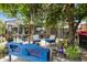 Inviting backyard featuring a covered patio and dining set, great for outdoor entertaining at 1656 W Meseto Cir, Mesa, AZ 85202