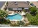 Aerial view of backyard showing pool, patio area and beautiful landscaping at 1656 W Meseto Cir, Mesa, AZ 85202