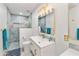 Modern bathroom featuring a luxurious shower with tile details, attractive fixtures, and a toilet at 1656 W Meseto Cir, Mesa, AZ 85202