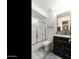 Well-maintained bathroom featuring a shower over tub, a modern vanity and tile flooring at 1656 W Meseto Cir, Mesa, AZ 85202