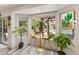 A sunny breakfast nook with seating for two and beautiful outdoor views at 1656 W Meseto Cir, Mesa, AZ 85202