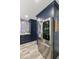 A gourmet kitchen with built-in stainless refrigerator and custom cabinetry at 1656 W Meseto Cir, Mesa, AZ 85202