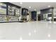 Gourmet kitchen with a large island, custom cabinetry, designer tile backsplash and gold hardware at 1656 W Meseto Cir, Mesa, AZ 85202