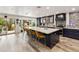 Modern kitchen with a large island, stylish bar stools, and blue custom cabinets at 1656 W Meseto Cir, Mesa, AZ 85202