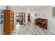 Interior view of the living room with hardwood floors and vintage furniture at 1656 W Meseto Cir, Mesa, AZ 85202