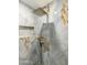 Elegant shower with a rainfall shower head and tiled walls, providing a spa-like experience at 1656 W Meseto Cir, Mesa, AZ 85202