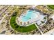 Beautiful aerial shot of a community pool area with lounge chairs, playground and green grass at 16760 W Hope Dr, Surprise, AZ 85388
