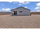 Single-story home features a covered patio and a gravel backyard at 18100 W College Dr, Goodyear, AZ 85395
