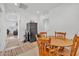 Inviting dining area with wood table, matching chairs and convenient access to adjacent living area at 18100 W College Dr, Goodyear, AZ 85395