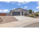 Charming single-story home with a two-car garage and desert landscaping at 18100 W College Dr, Goodyear, AZ 85395