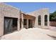Backyard patio with stucco walls and arched windows at 1861 E Bendix Dr, Tempe, AZ 85283