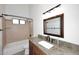 Bathroom features a granite counter, tub/shower combination, and tile accents at 1861 E Bendix Dr, Tempe, AZ 85283