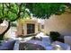 Inviting walkway leading to a charming home with mature shade tree and decorative front door at 1861 E Bendix Dr, Tempe, AZ 85283
