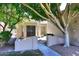Inviting walkway leading to a charming home with mature shade tree and decorative front door at 1861 E Bendix Dr, Tempe, AZ 85283