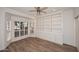 Inviting home office with custom built-ins, wood floors, and natural light at 1861 E Bendix Dr, Tempe, AZ 85283
