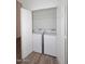 Laundry closet with a new side-by-side white washer and dryer at 1861 E Bendix Dr, Tempe, AZ 85283