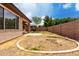 Backyard with fenced perimeter and new landscaping ready for your personal touch at 18719 E Pelican Ct, Queen Creek, AZ 85142