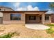 Home's backyard featuring a covered patio area and spacious yard at 18719 E Pelican Ct, Queen Creek, AZ 85142