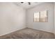Clean bedroom with neutral carpeting and a window that brings in plenty of natural light at 18719 E Pelican Ct, Queen Creek, AZ 85142