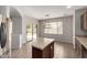 Eat-in kitchen features tile floors, wooden cabinets, and sliding glass doors at 18719 E Pelican Ct, Queen Creek, AZ 85142